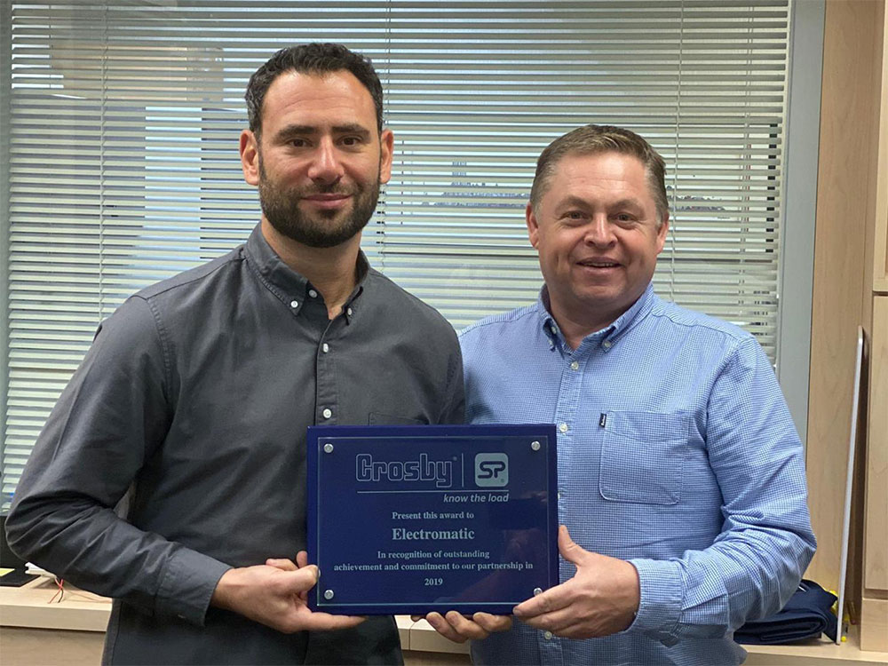 David Ayling (right) was on hand to present Electromatic’s Brett Linzer with its award during a pre-scheduled visit.