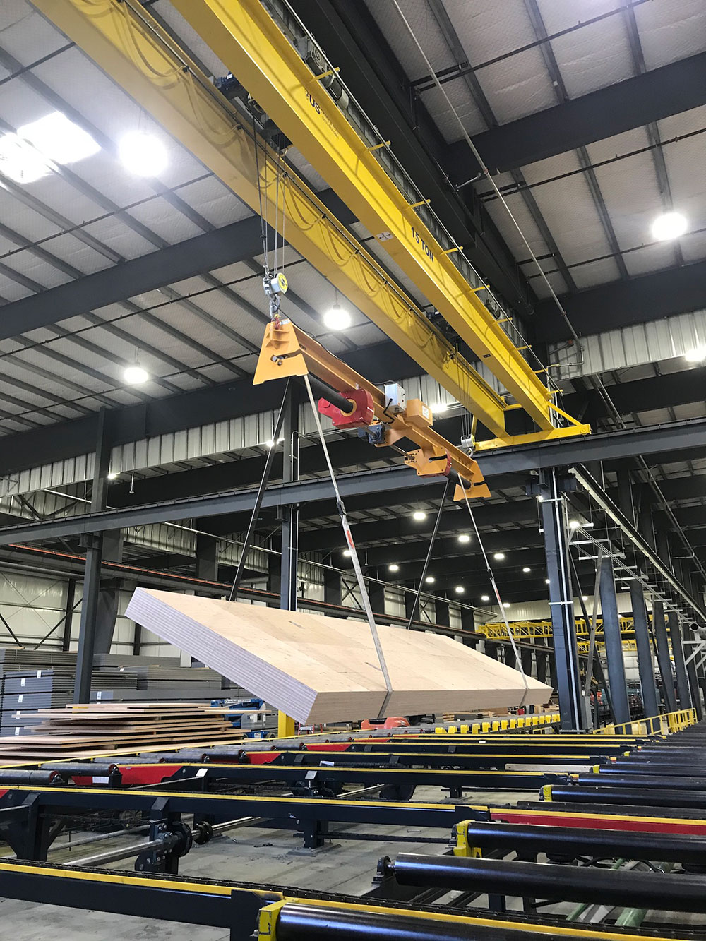 The Posi-Turner is operated beneath the hook of a 15-ton capacity overhead crane.