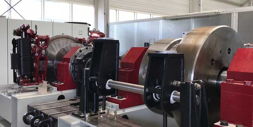 The larger test stand (pictured here with the guards removed) is used for large caliper and hydraulic brakes.