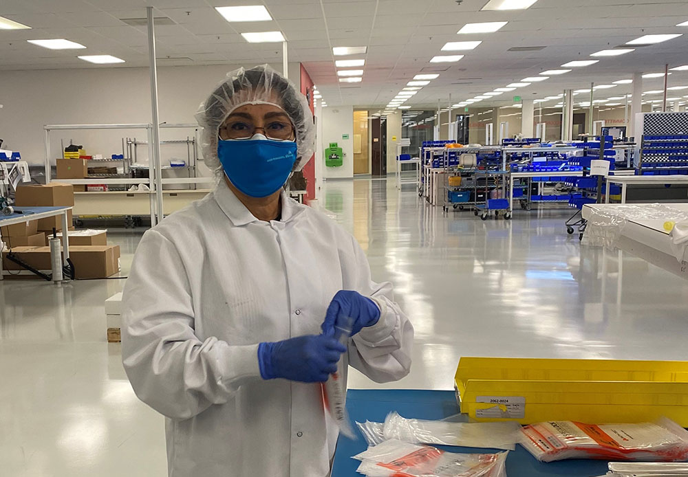 Marta Kolar, Earn and Learn Pilot Program participant, learns about biomedical manufacturing on the job.