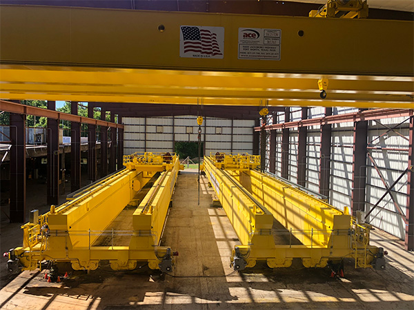 250/25 ton overhead cranes used in the aerospace industry. These two cranes have a span of 201 ft. each.