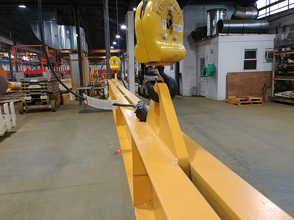 The centerpiece of the installation was a 1-ton capacity twin-hook Caldwell lifting beam.