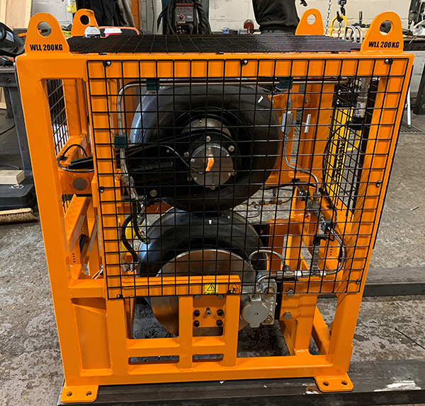 The tyres are connected to a hydraulic cylinder to clamp the wheels together.