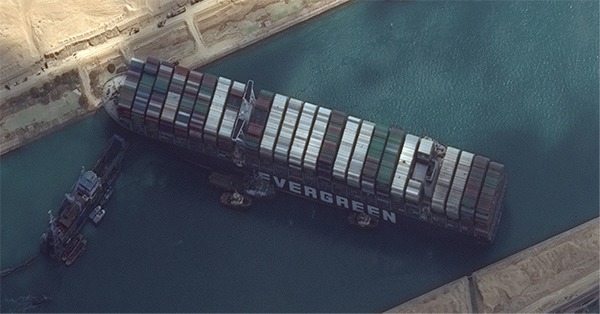 The 224,000-ton Ever Given shipping vessel blocked the Suez Canal for six days in March 2021, heavily disrupting global maritime traffic. Source: Maxar Technologies. (2021, March 26). Image of Ever Given. [Photograph]. Maxar Technologies. https://twitter.com/maxar/status/1375463844462653442.