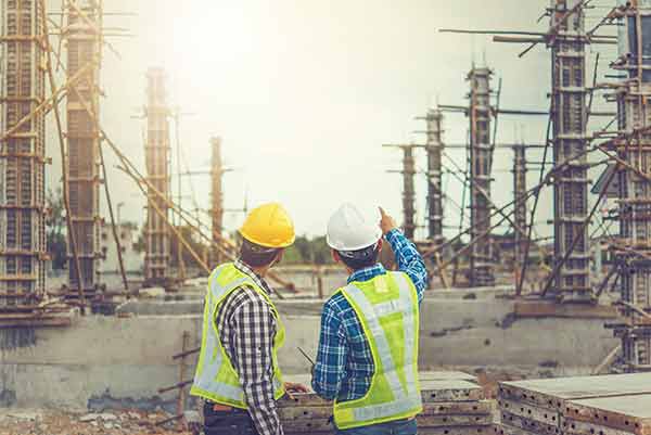 Engineers On The Construction Site Discussing The Building Plans Image 2, Industry Today
