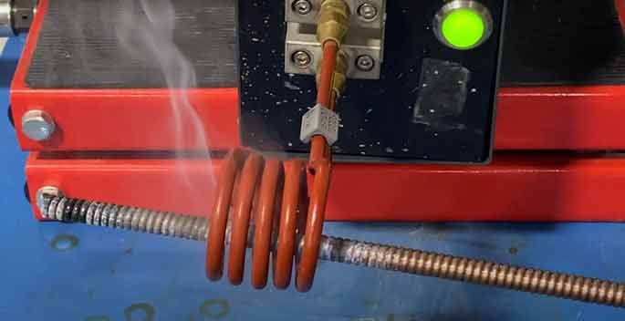 induction preheating of music wire before coiling