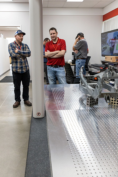 CMM, viewed by attendees, measuring a suspension section