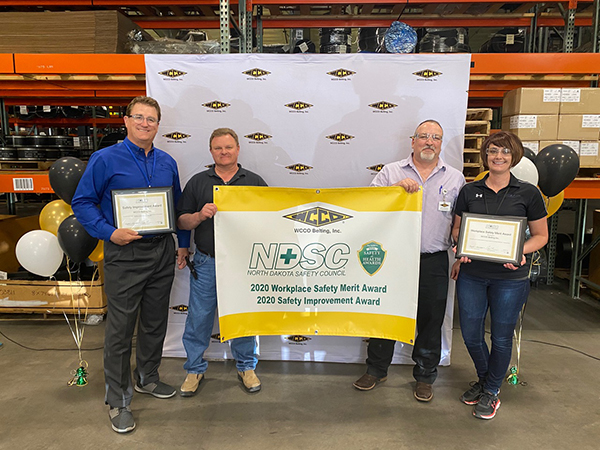 (From left to right) Tom Shorma, Dewey Miller, Rod Koch and Stefani Mikkelson accepted two awards from the North Dakota Safety Council at a ceremony. 