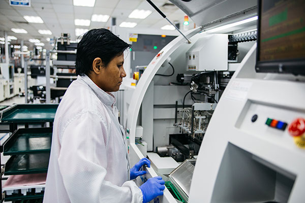 A Flex employee working on an advanced manufacturing line