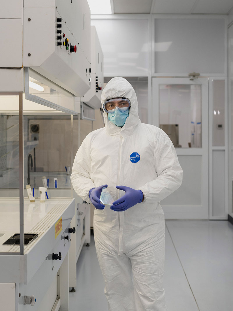 Employees work in a cleanroom environment made up of fresh air, a filtered air system and positive pressure in an enclosed room system.