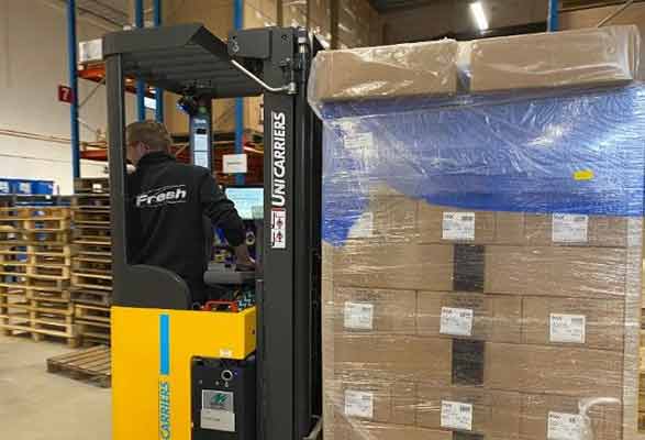 forklift moving fresh ab product in warehouse