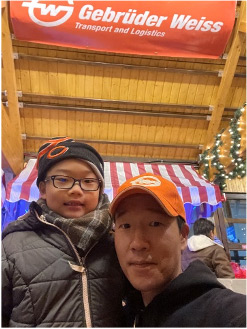 Gebrüder Weiss National KYoung Lee and his son volunteer at the Christkindlmarket in Chicago to collect toys for needy families.