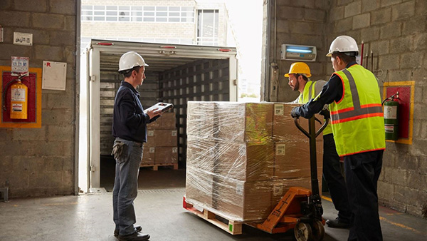 Mobile devices help workers manage receiving and shipping actions and conduct quality control checks before pallets are loaded onto trucks.