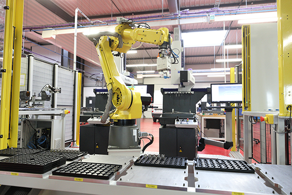The facility has automated production processes and robots for real-time data collection and remote monitoring from different smart devices.