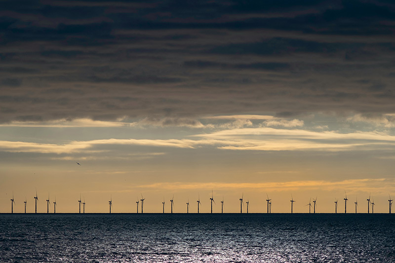 offshore windfarm image unsplash by zoltan tasi