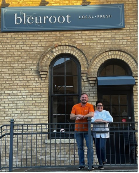 Gebrüder Weiss Director of Sales, Merlin Dow pictured with owner of Bleuroot restaurant to provide meals to family in West Dundee.