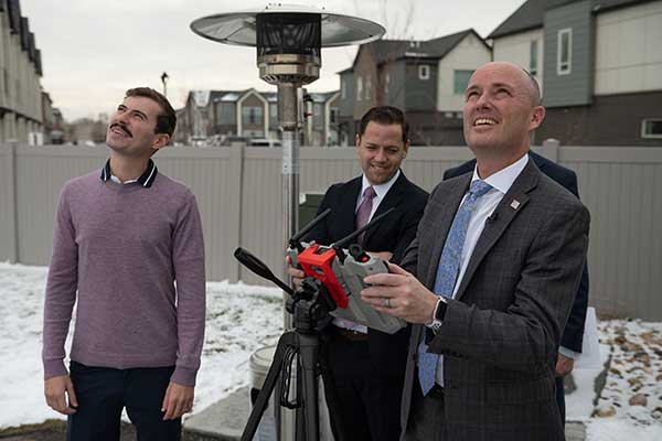 Gov. Cox, far right, pilots a Teal drone under the supervision of Teal Founder and CEO Geroge Matus, far left.