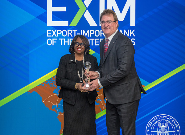 tom shorma and chair lewis wcco belting accepting exim exporter of the year award