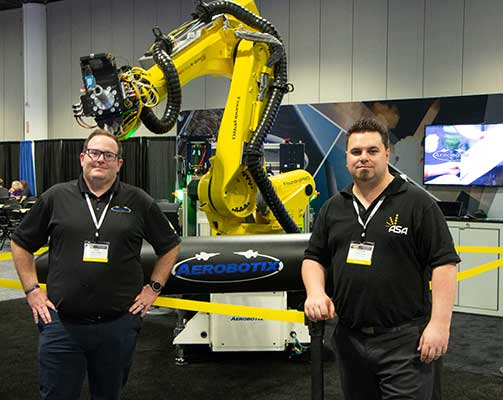 Josh Tuttle and Nathan Jones with robotics display