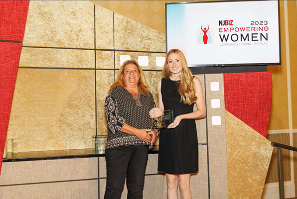 violet pr receiving njbiz empowering women award